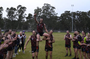 Wandella coach re-signs