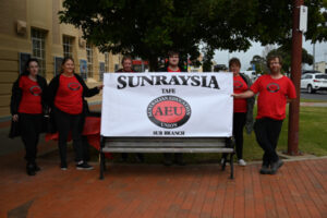 Picketers back pay claim