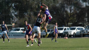 Top teams clash in three-point thriller