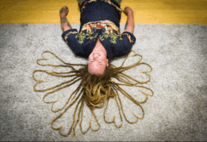 Preparing to lose his dreadlocks