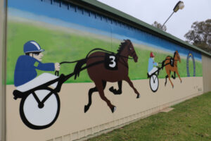 Mural pays homage to trotters and drivers of old Nyah District Harness Racing Club (1965-2012)