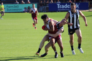 Magpies win bruising contest with Swans