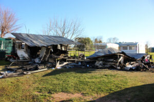 Charred metal after caravans burn