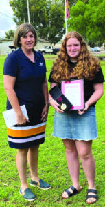 Young citizen looks beyond own fence