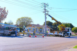 Truck driver ploughs into power pole