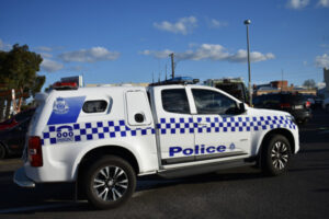 Woman hit by reversing car