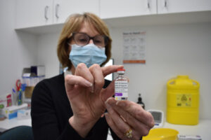 Residents roll up at pharmacies for COVID jabs