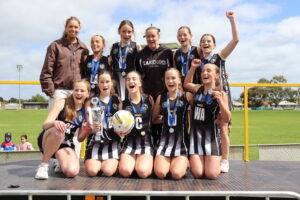 Magpies fly to flag
